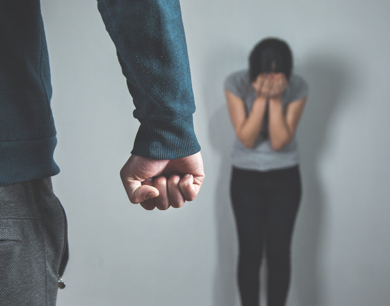 man showing his first as anger showing early signs of a controlling man