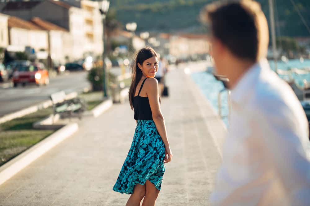 Young attractive woman flirting with a man on the street. new relationship and recently single