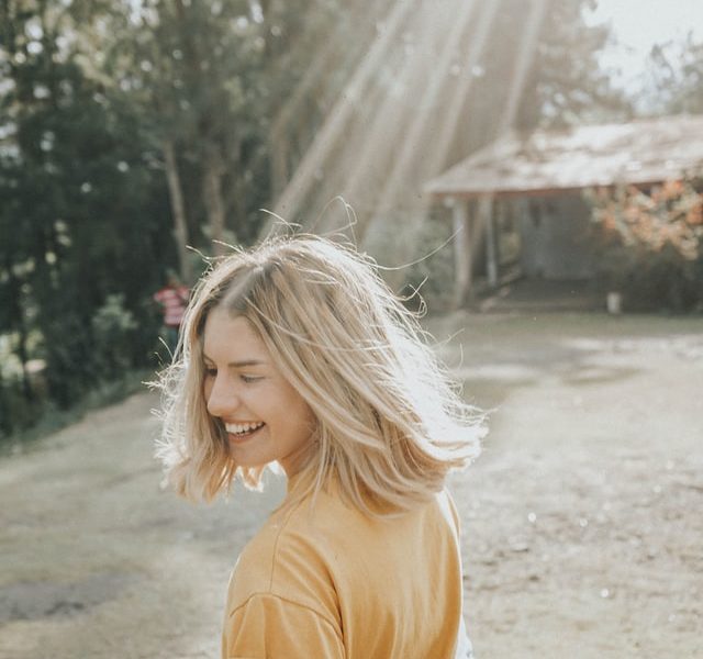 happy woman in her 20s after realizing she has so much more to live than feeling lost