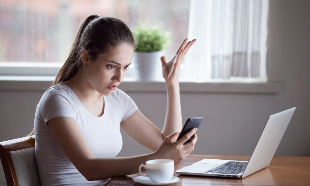 Mad woman annoyed by having problems with smartphone wondering Why Does He Keep Me Around If He Doesn't Want A Relationship?