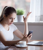 Mad woman annoyed by having problems with smartphone wondering Why Does He Keep Me Around If He Doesn't Want A Relationship?