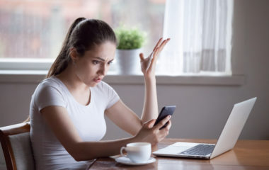 Mad woman annoyed by having problems with smartphone wondering Why Does He Keep Me Around If He Doesn't Want A Relationship?