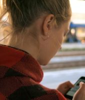 girl using her phone checking social media