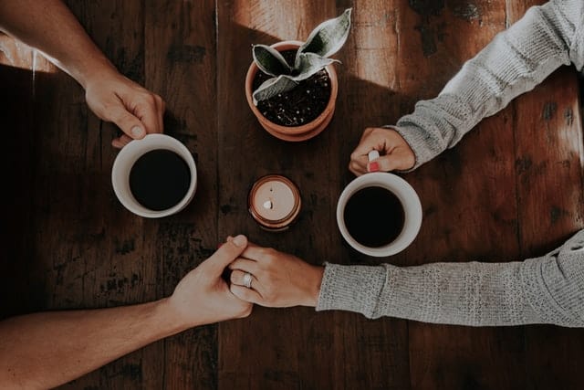 guy needing support from girl without commitment, holding hands 