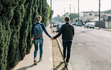 couple holding hands together