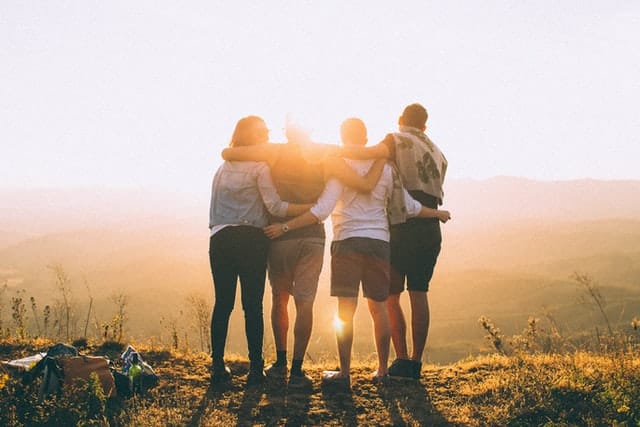 church community group of friends hugging each other 