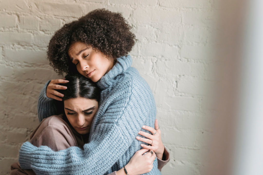 girl helping friend getting over a break up