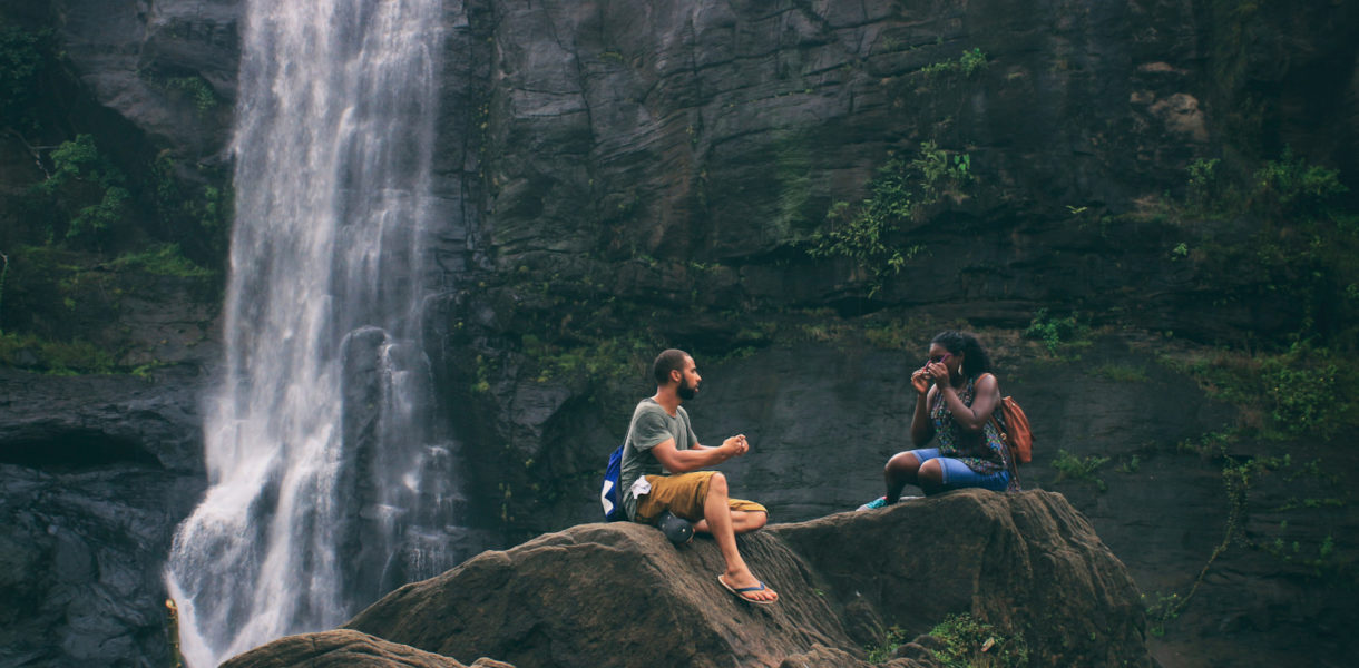 couples hanging out together in a hike