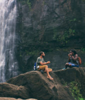 couples hanging out together in a hike