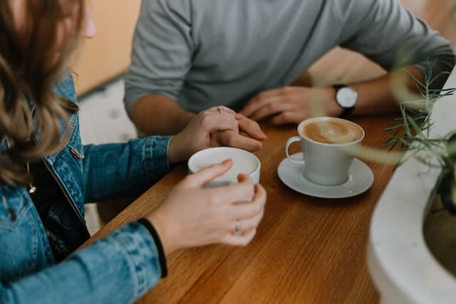 girl is having coffe with a guy who is her backup guy