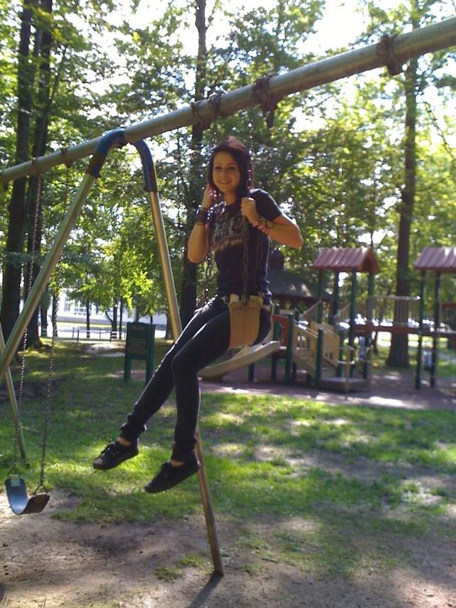 A person on a swing

Description automatically generated
